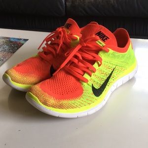 Orange and yellow Nike Free Flyknits 4.0